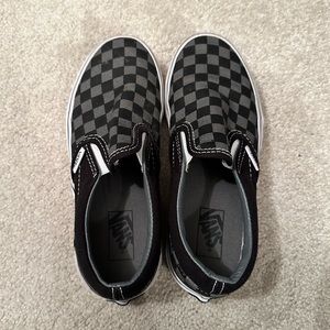 Black & gray checkered slip on Vans.